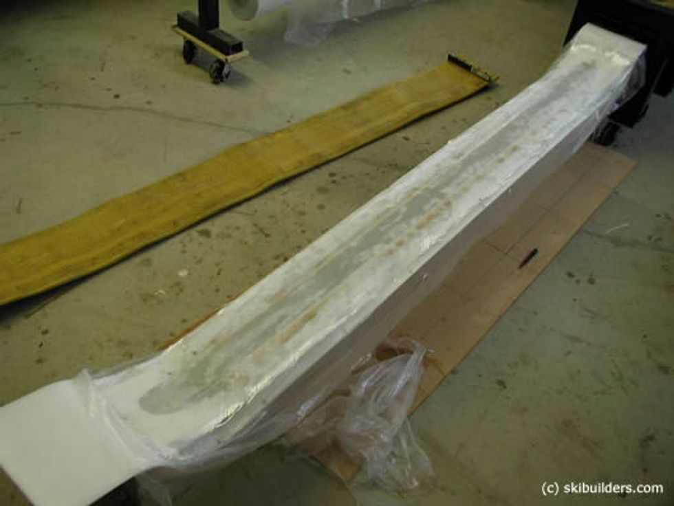 On top of the core, add the second layer of composite material along with a coat of epoxy