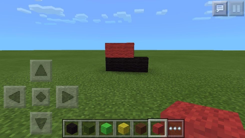 On top of the first two from the left, place two red wool blocks.