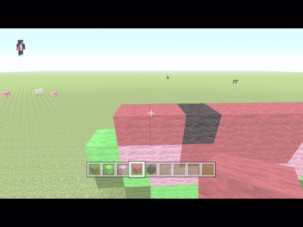 On top of the pink wool put red wool and 1 black wool anywhere as a seed
