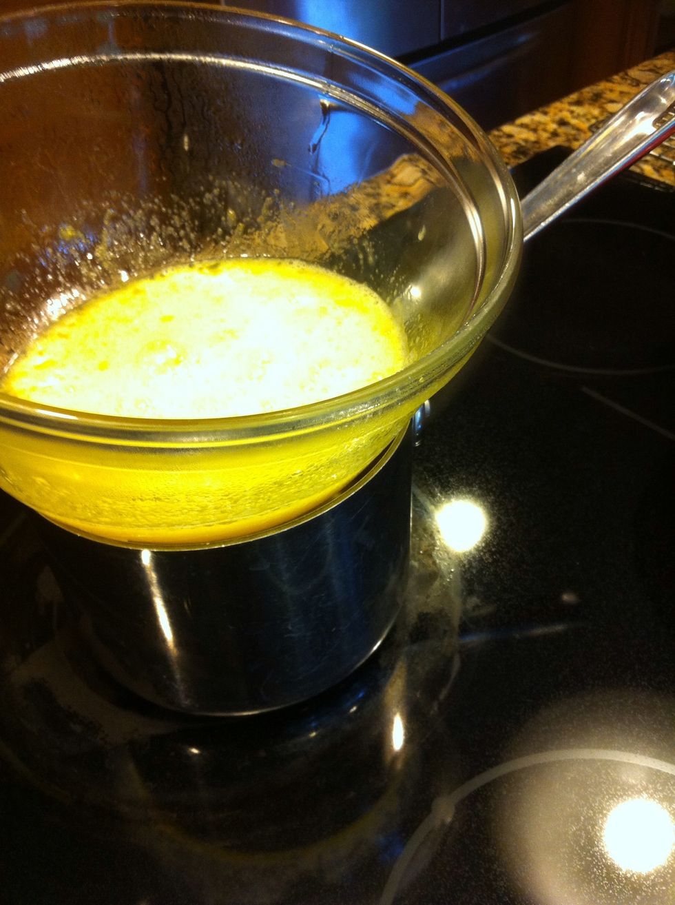 On top stove, in a double boiler, warm up 3 eggs, 2 yolks and 1/2 c sugar. Just let this warm to touch