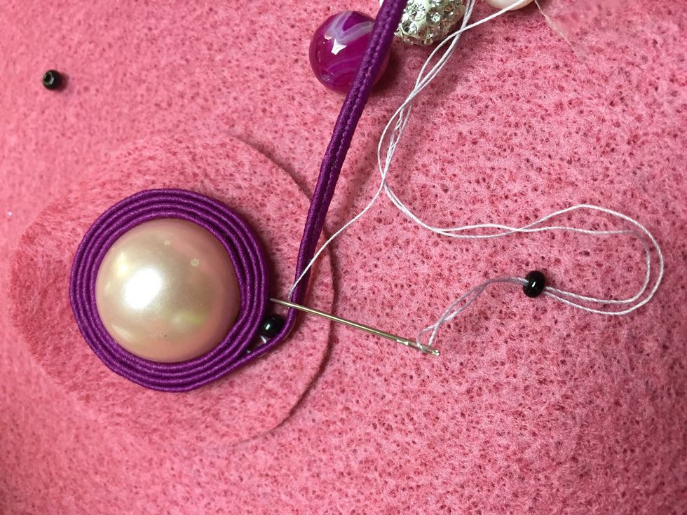 On your 4th row start filling your design with some seed beads