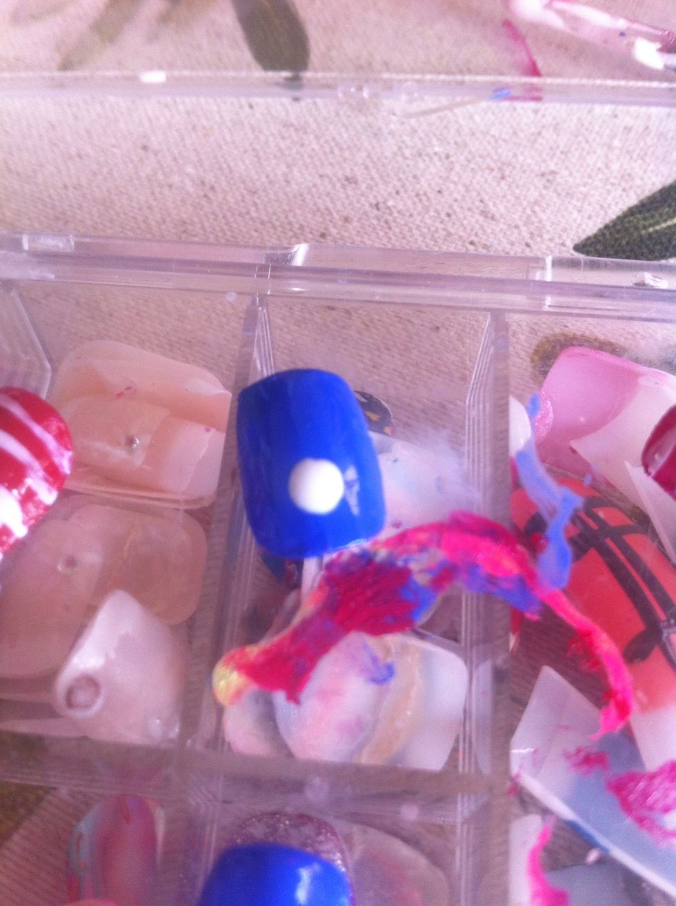 On your blue nails add a fairly large white dot.