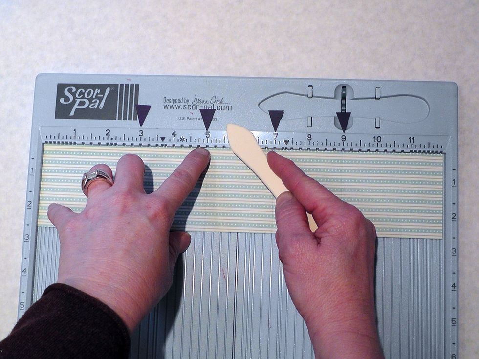 On your long strips, score on the back side at 3, 5,7, and 9 inch marks. If using a ruler just make a tiny dash with a pencil and make a small fold at each measurement- dont fold down hard-just crease