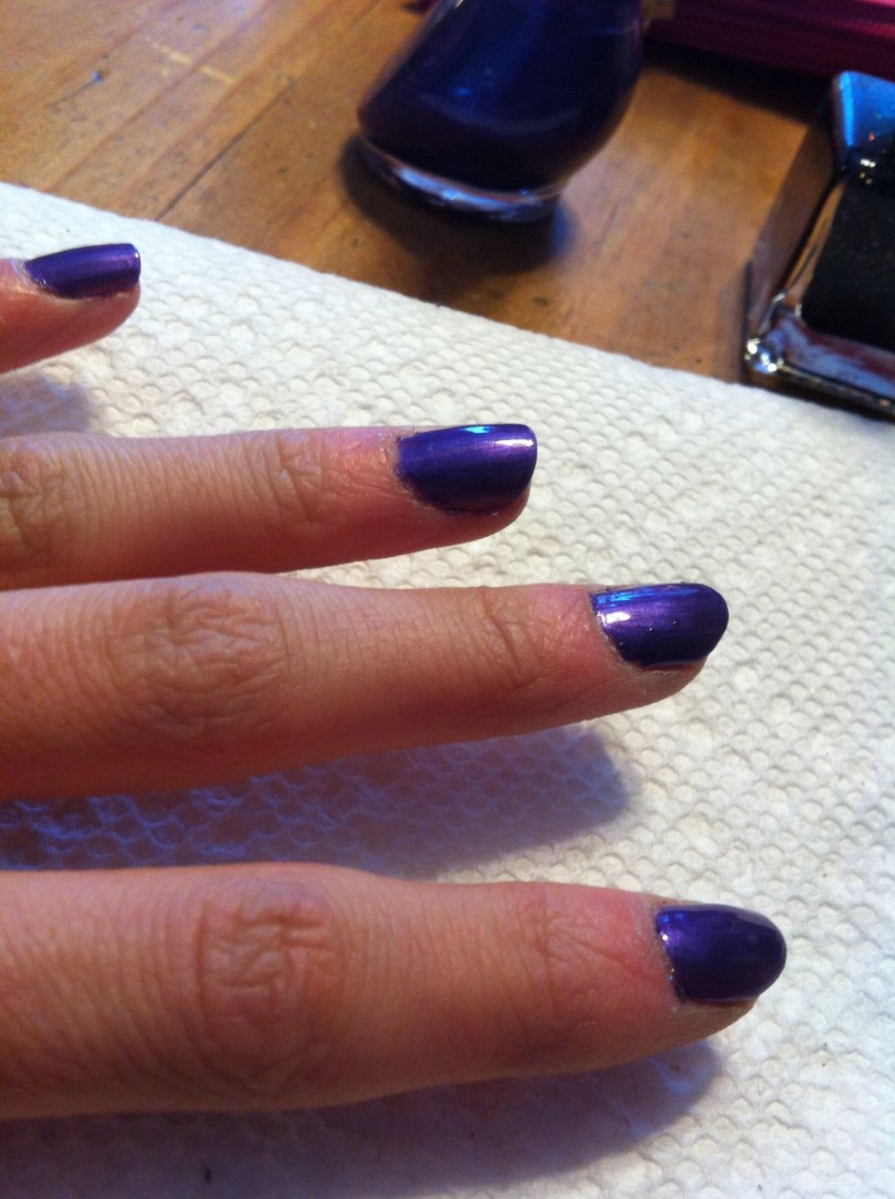 On your other four nails, paint on a deep purple polish. I did two coats of Nicole Purple by O.P.I.