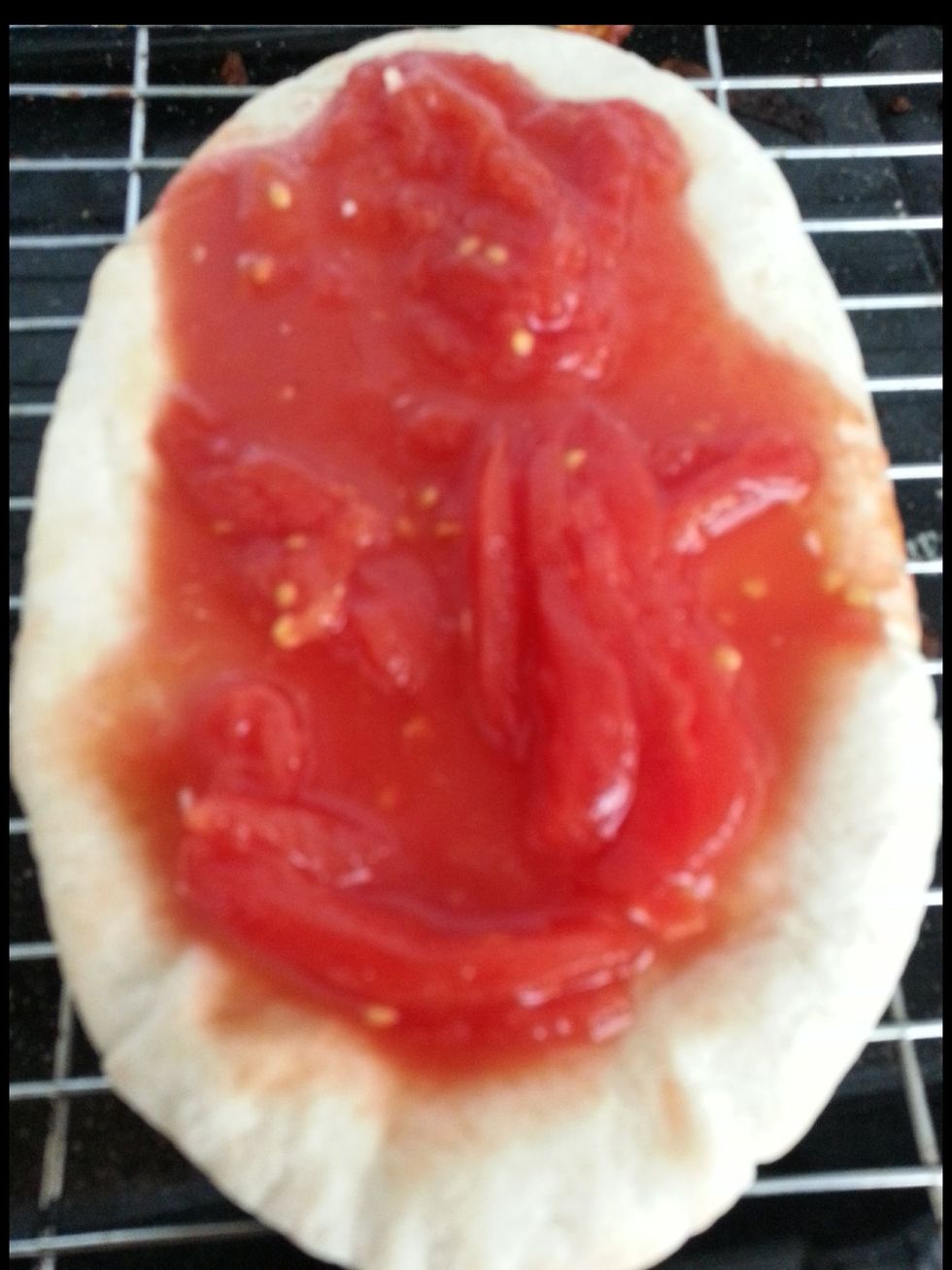 On your pita bread spread some tomatoe puri. (Canned version) or Amy paste you wish Since I only had white pita I done it on this. But the healthier version which I prefer is the whole meal brown