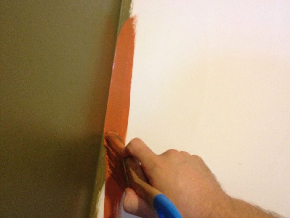 On your second stroke press the bristles firm against the wall and get closer to the corner to make your nice straight line. No tape is needed unless you really aren't any good with your hands.