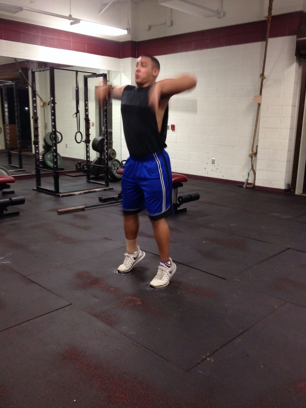 On your tip toes pull the bar up to your chest.