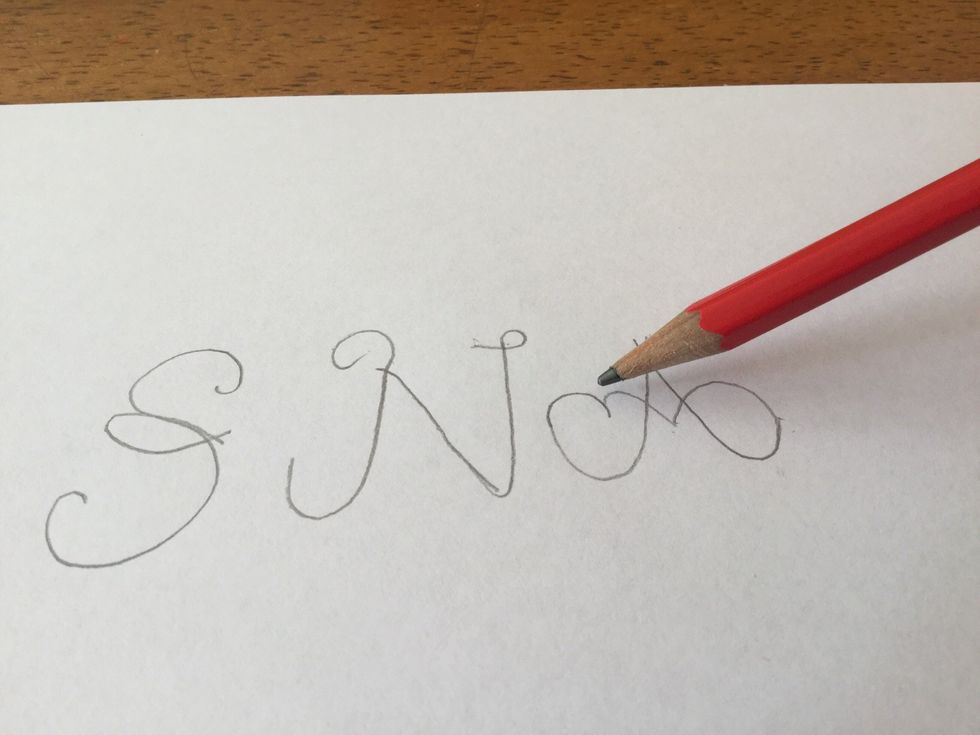 Once again starting where you just finished off draw a small diagonal line the looping at the end