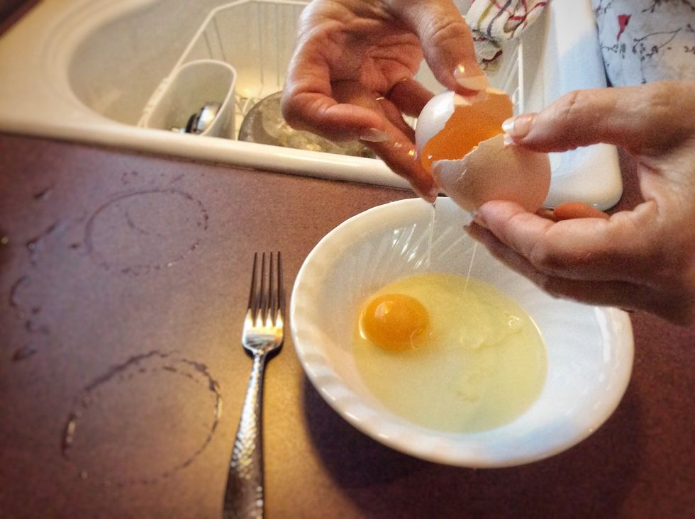 Once again, you should get another small bowl. This time, you need to crack 2 eggs (the whole egg, not just the whites), and beat them with a fork until they are completely mixed.