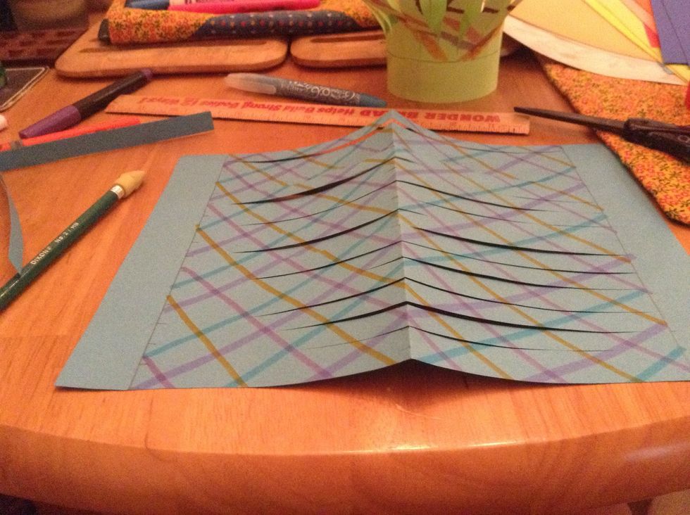 Once all are cut unfold use eraser to erase pencil mark not the ones seperating blank from design