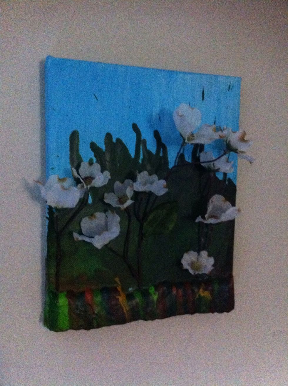 Once all dry take your silk flowers and crazy glue them on to your canvas. And hang it on the wall! (this was my first try! Don't think it came out too bad. I will be doing it again!)