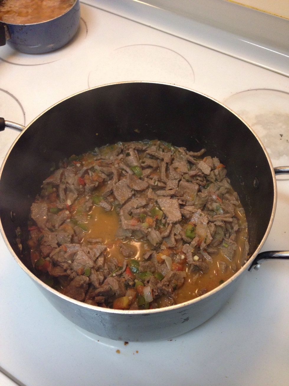 Once all has come to a boil, add meat back in to the pan. Cover. Stir for about 5-10 mins. Once done turn off.