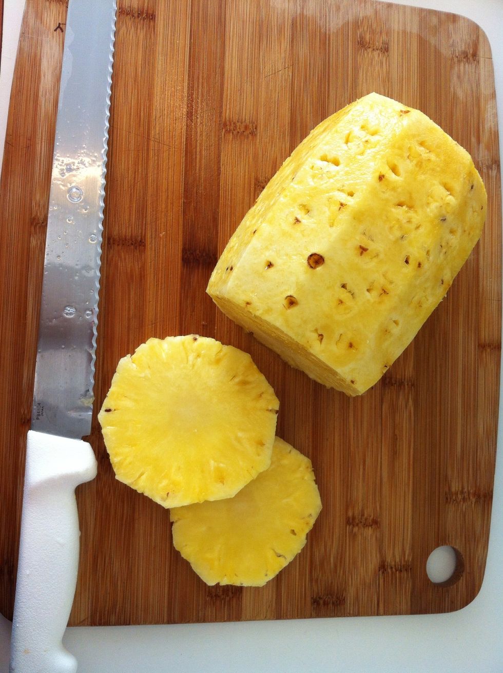 Once all is clean proceed to cut the pineapple to the desired shape. You can do all slices and then remove the fibrous core/center of each slice with a round cookie cutter.