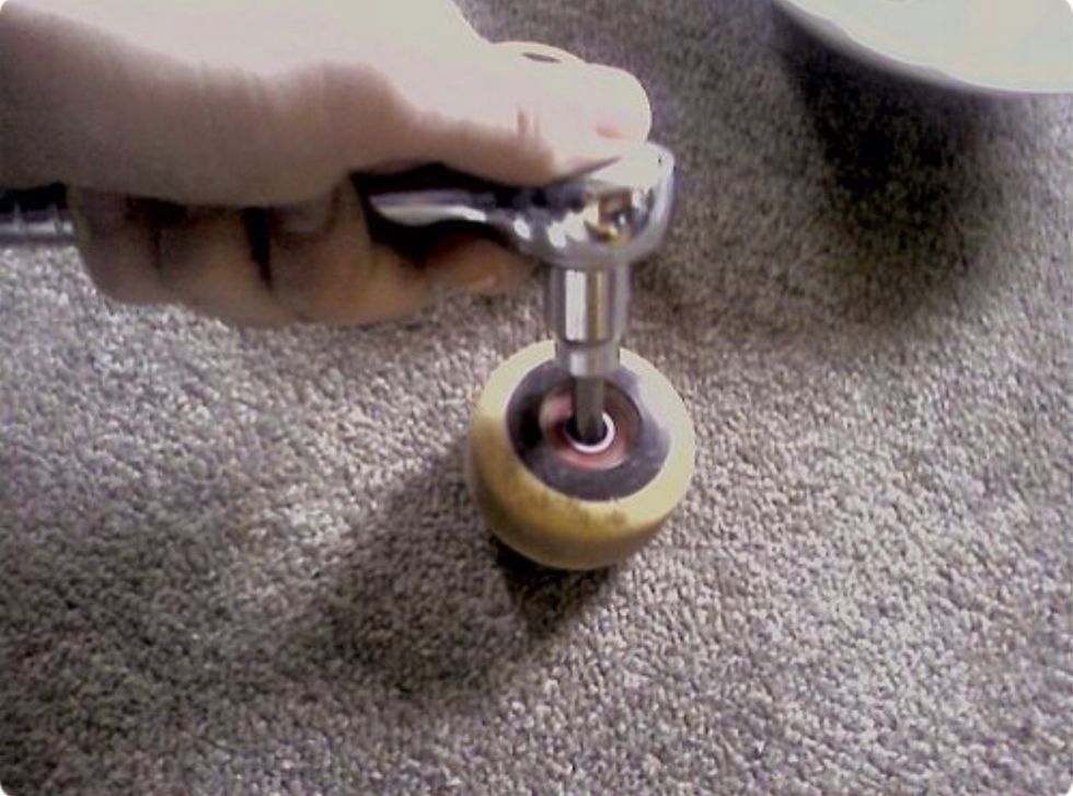 Once all of the bearings are out, fill a dish with olive, sunflower, or canola oil and drop them in to soak for a little while.