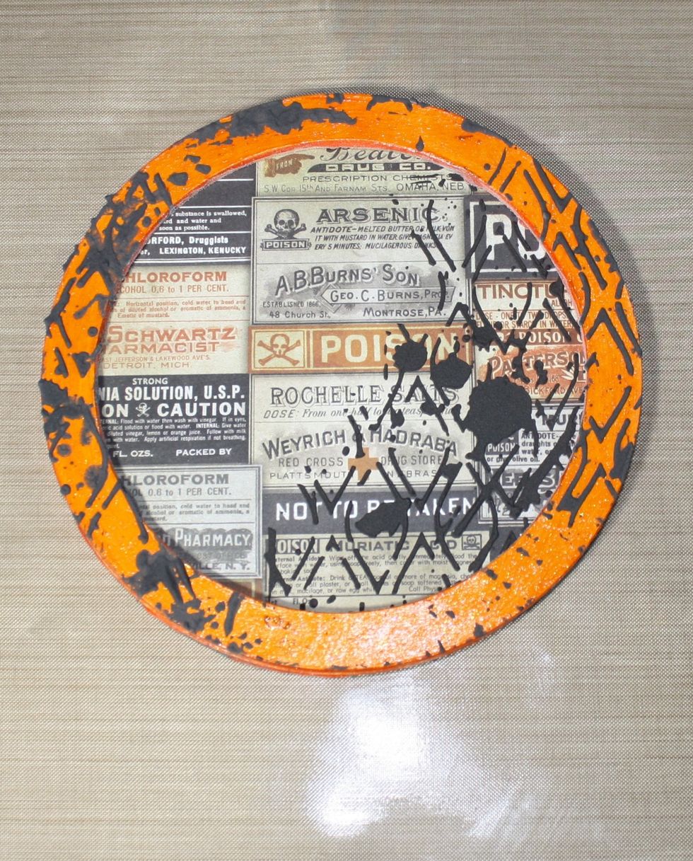 Once all pieces are dry, glue the scrap paper to the large circle frame back, and glue the open circle piece to the top.