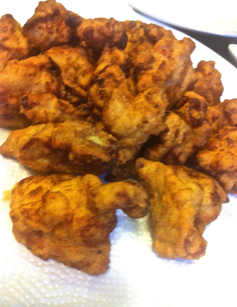 Once all the chicken cubes has been fried, refry the chicken, starting from batch that was fried first. Cook till chicken cubes turn deep golden brown, about 2 min. Drain on paper towel  lined plate.