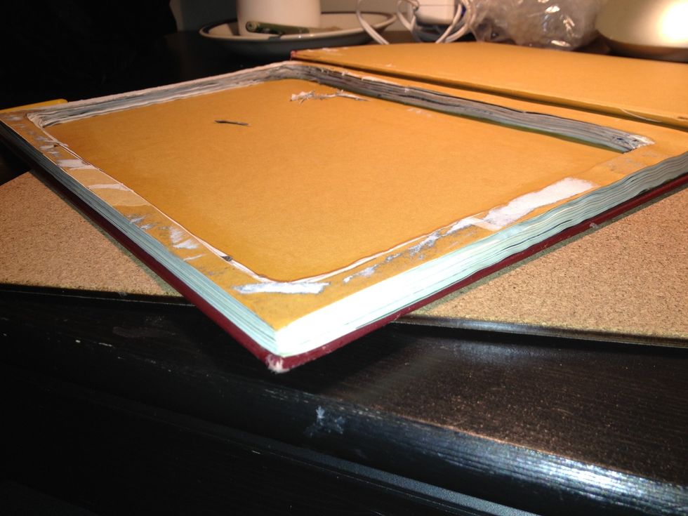 Once all the paper has been removed, use paper glue and a paint brush to glue the pages together.