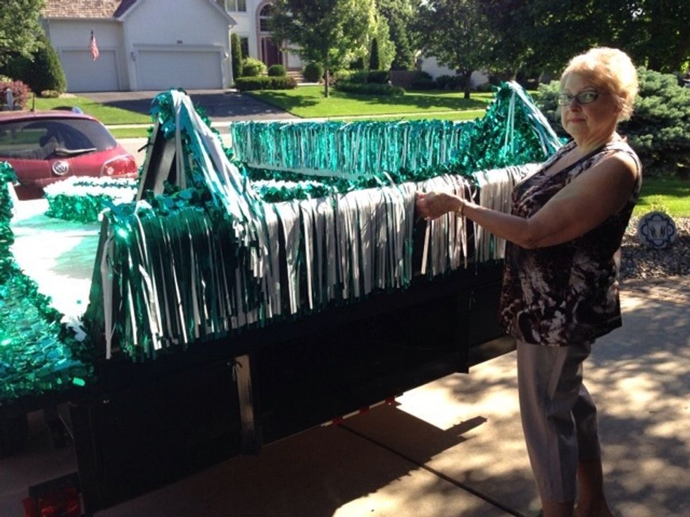 Once all the sides are folded up, make sure all the decorative float fringe is flipped up on the INSIDE of the float.