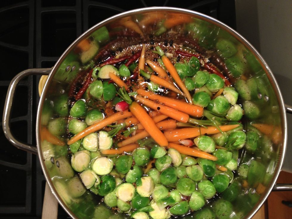 Once at a boil, and the sugar and the salt have dissolved, add the brussels sprouts, carrots, and turnips. Cook until just barely crisp-tender, about 5 minutes.