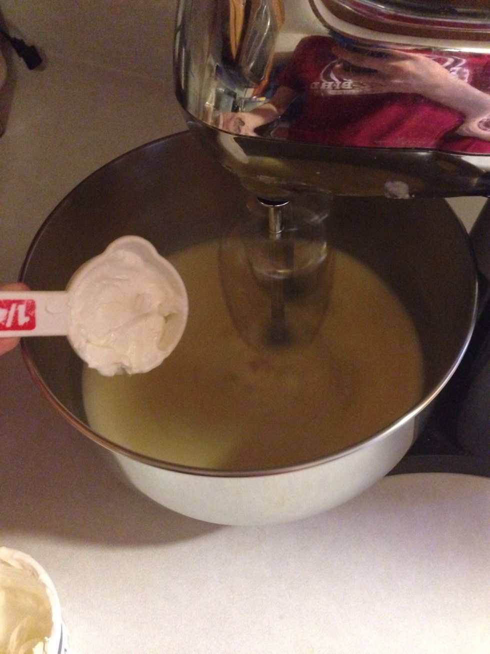 Once banana is mashed. Add in the sour cream