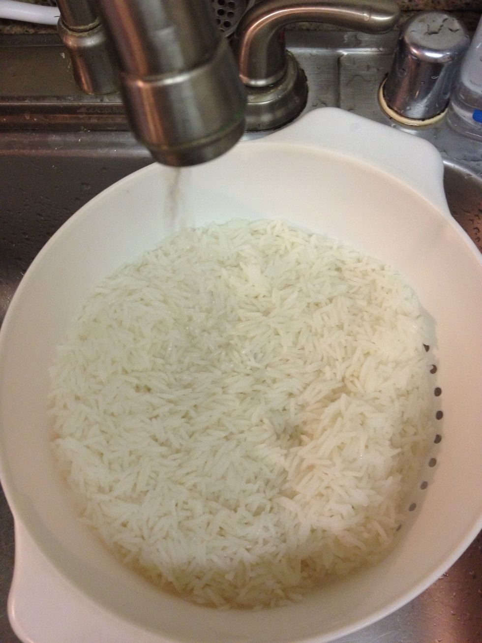 Once barely cooked through, rinse thoroughly and drain. Once cooled the rice can rest in this state for up to an hour,  while you get the grill going etc...
