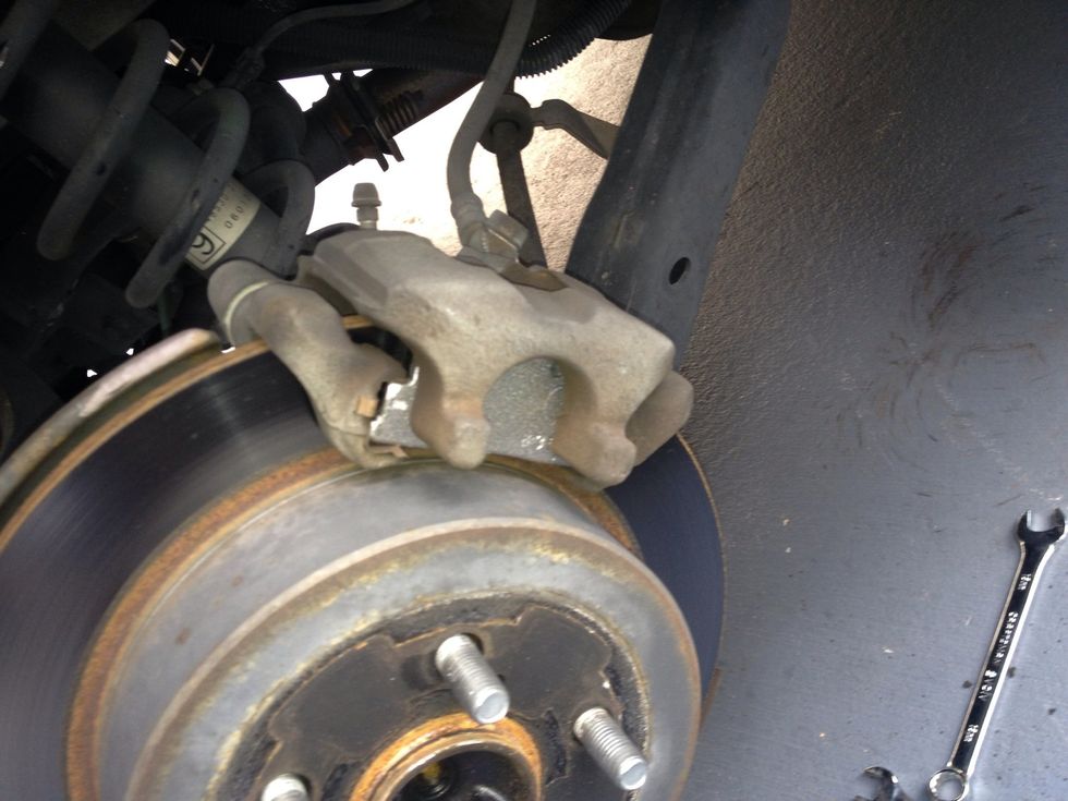 Once both pads are in, reinstall the caliper