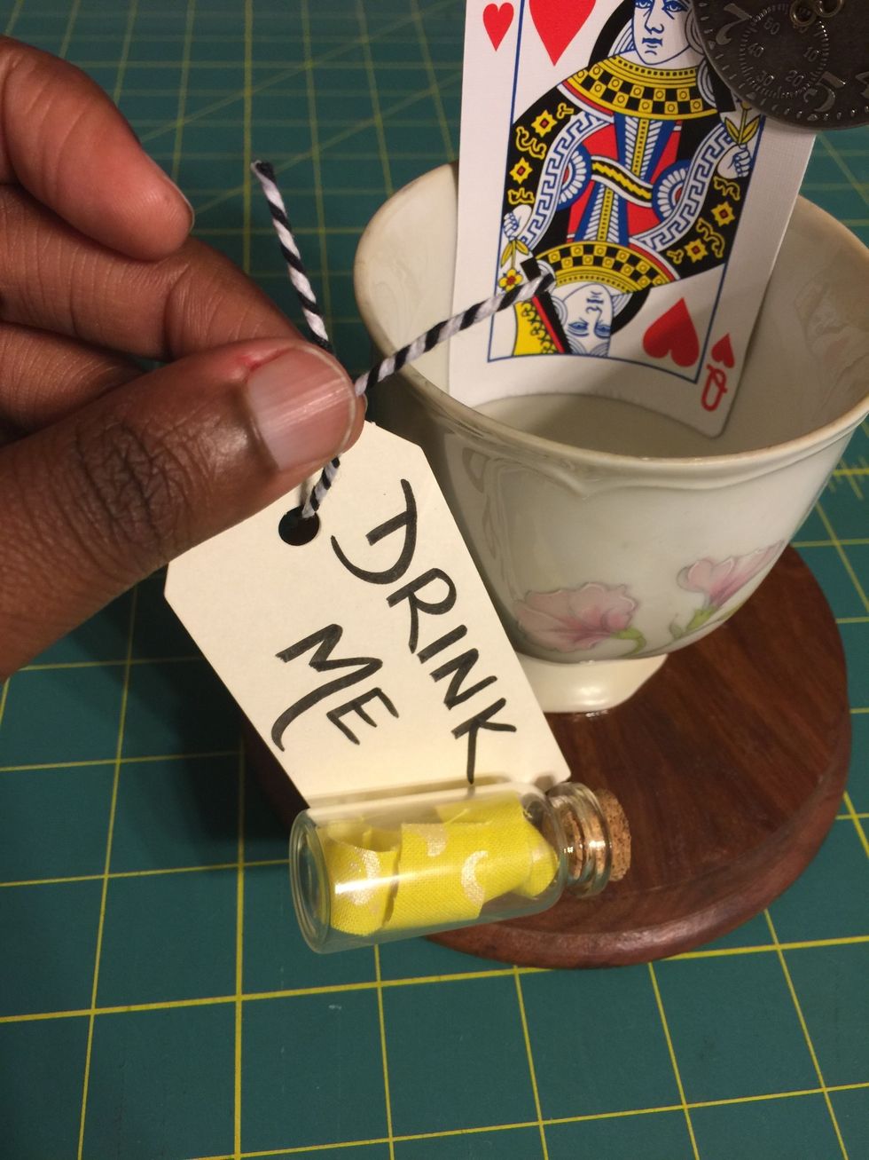 Once both pieces are dry, take your twine and tie your drink me tag on your teacup.