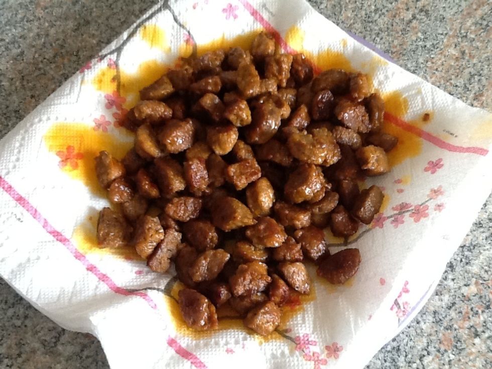 Once brown, place them on a separate plate to drain. Drain most of the remaining oil from the pan, but not all.