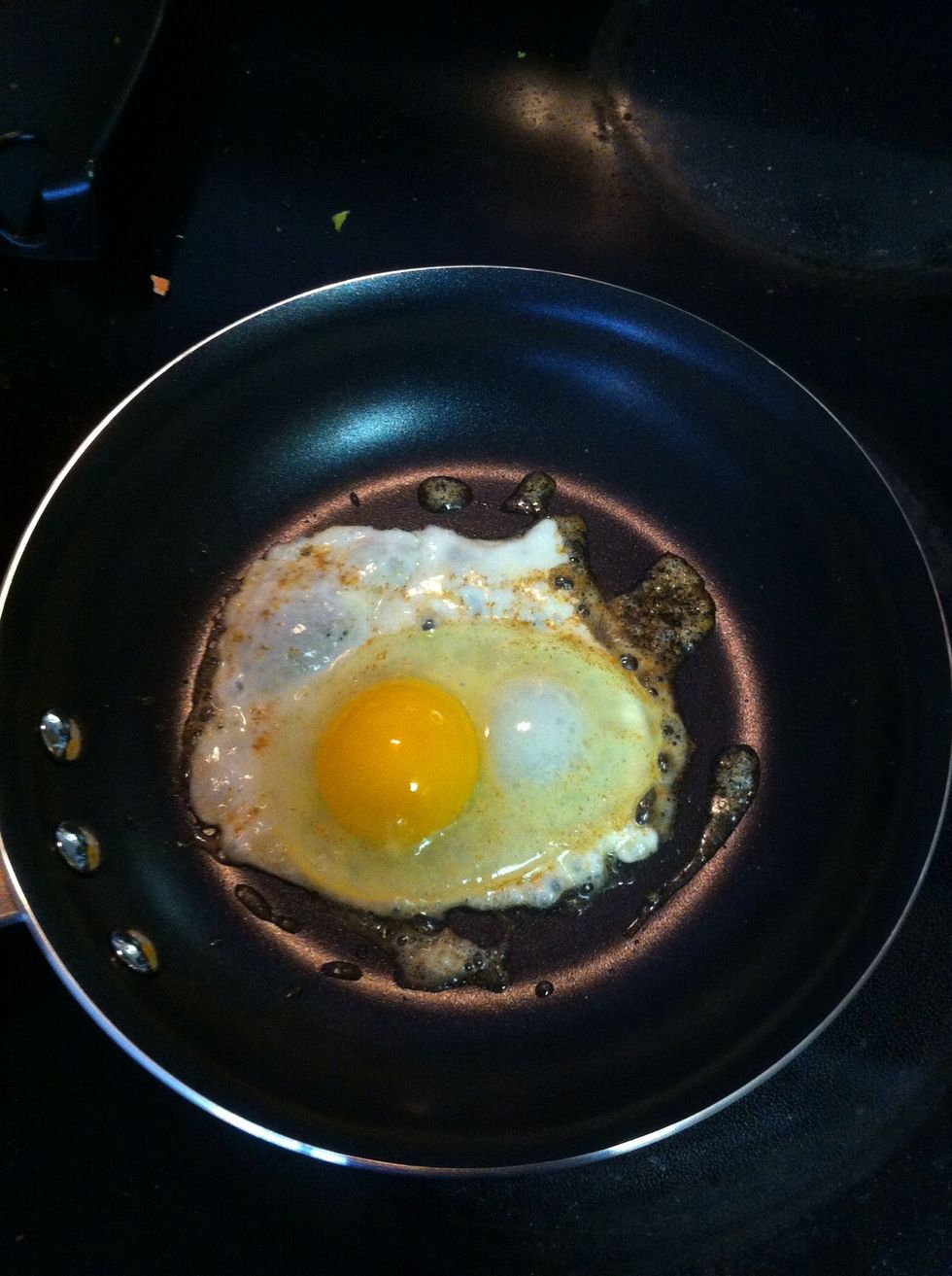 Once butter is melted, carefully crack your egg into skillet. Key is to not bust the yolk.