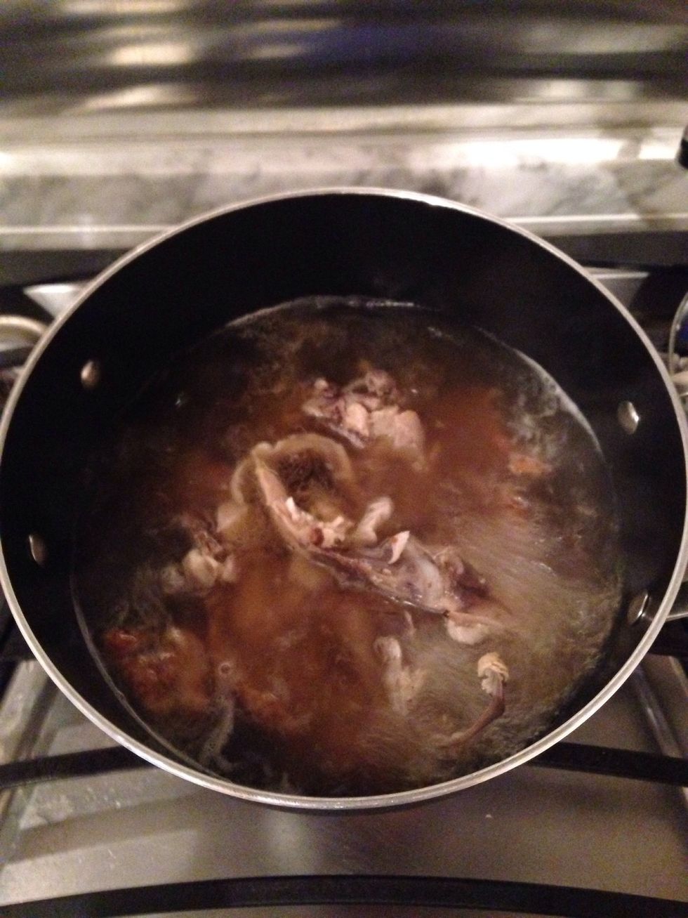 Once carcass starts to boil, turn the heat down and simmer. It should cook for at least 1.5 hours. You can cook it longer if you want a stronger chicken flavor in the stock