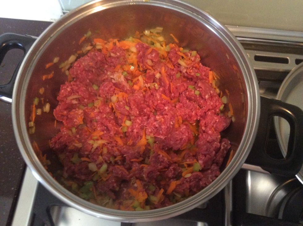 Once celery, onion and carrot is saut\u00e9ed, add the mince beef and continue to stir until brown.