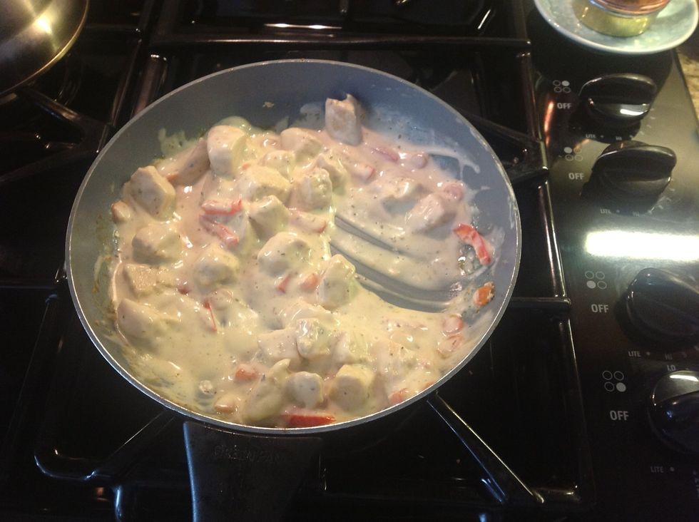 Once chicken is cooked add in peppers, carrots, and Alfredo sauce