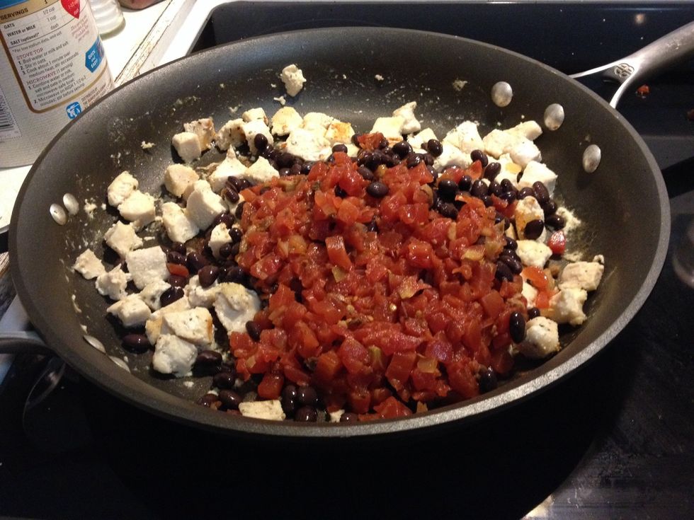 Once chicken is done, turn off heat, it is safe to add beans, tomatoes, and corn. You don't want to cook the beans tomatoes and corn any more.