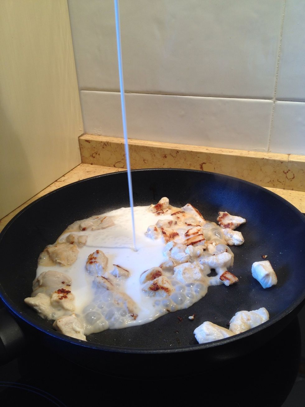Once chicken is ready add coconut milk