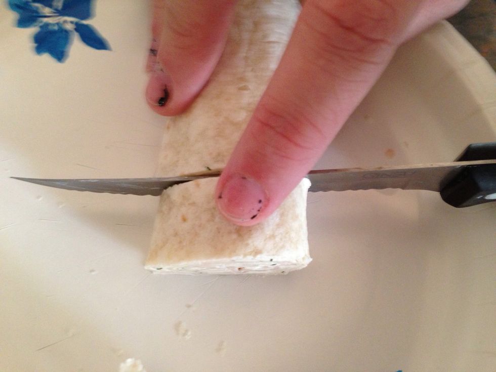Once chilled,, take rolls out ONE BY ONE and slice into 1/2 to 3/4inch pieces. You will have to throw away the ends of the tortilla. After slicing, put back in refrigerator for 10min, then serve!