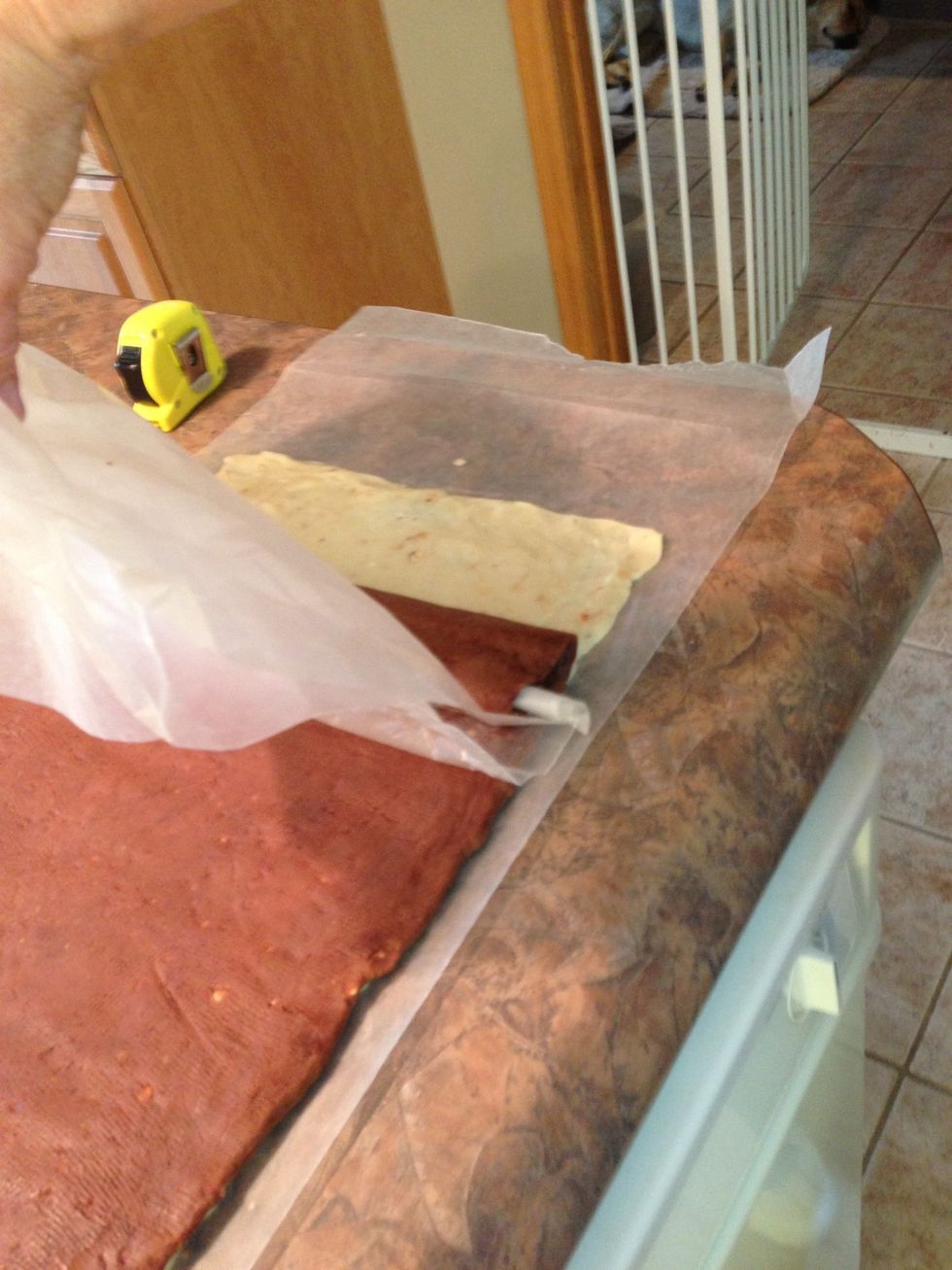 Once chocolate is over white, the recipe suggests rolling it a little thinner and longer... From 17" to 18-19" on the long side. This thins the dough a bit and makes for more cookies.