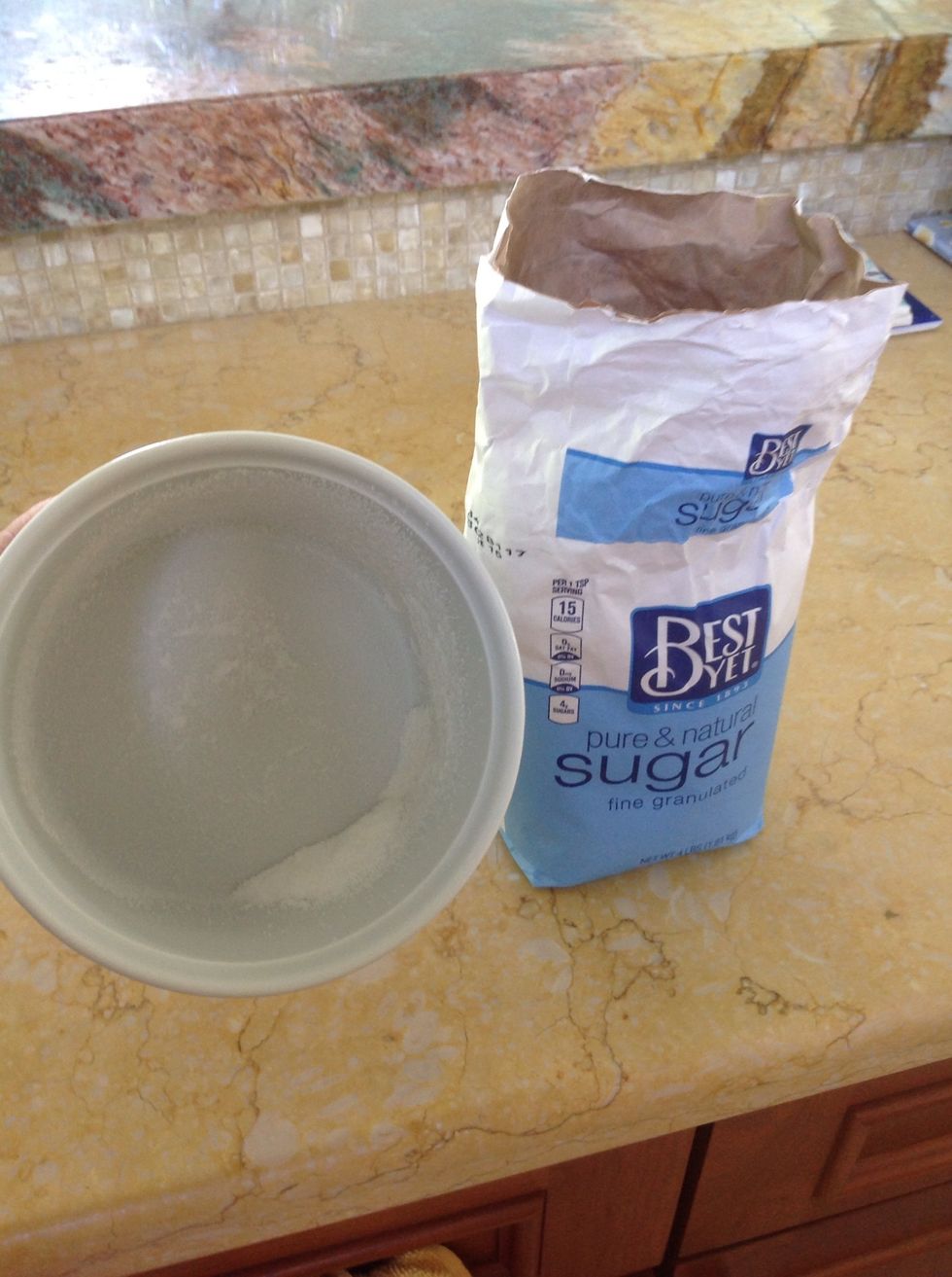 Once coated with butter, dust bottoms and sides with sugar.