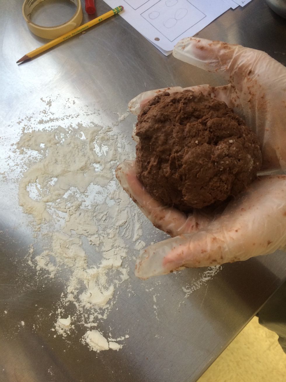 once completely combined, (if dough is too sticky add a little flour, or if it's too dry and a little water) form into a ball
