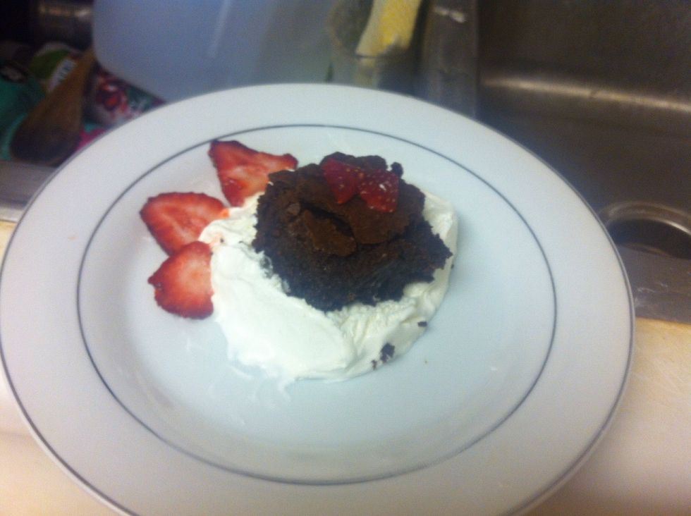 Once completely cooled, cut the brownie into small squares. You can either eat it just like that or pair it with vanilla ice cream and strawberry slices.