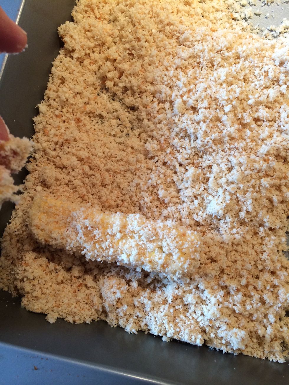 Once completely covered in breadcrumbs put aside and repeat with the other sticks.