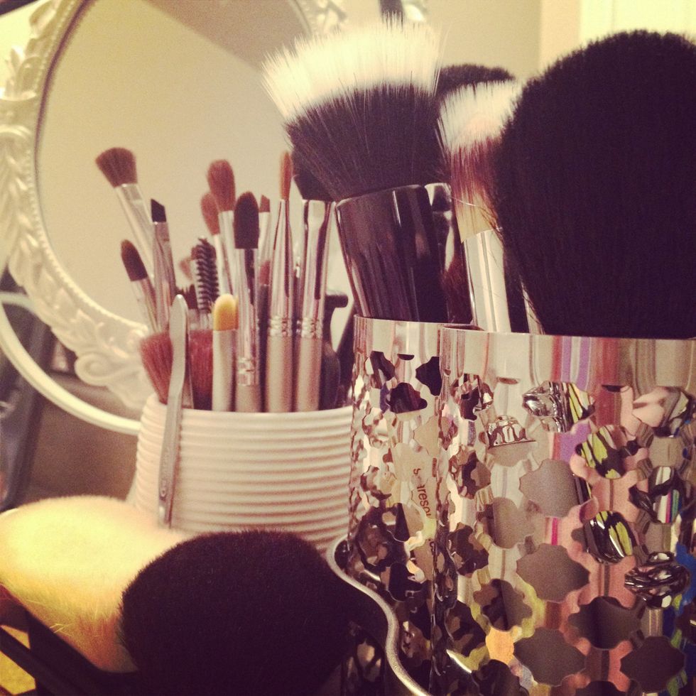 Once COMPLETELY dry, store your clean makeup brushes in either a brush binder or kit, or upright in containers.