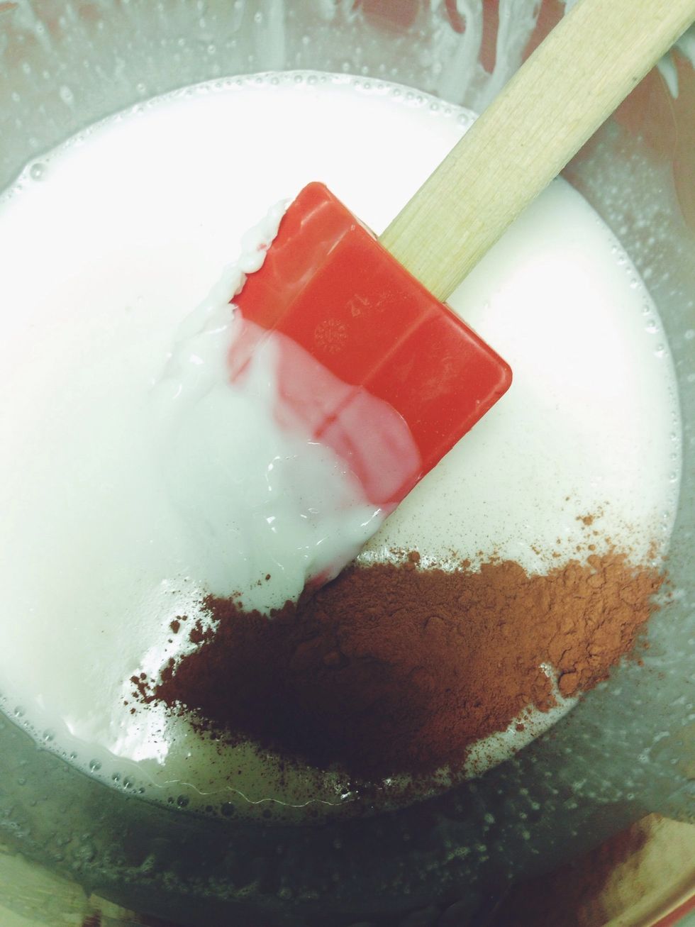 Once completely melted, add in your colorants. I used red clay (use 1 or 2 tsp per lb of soap) because it is all natural and has benefits such as drawing toxins like a magnet! Mix completely.