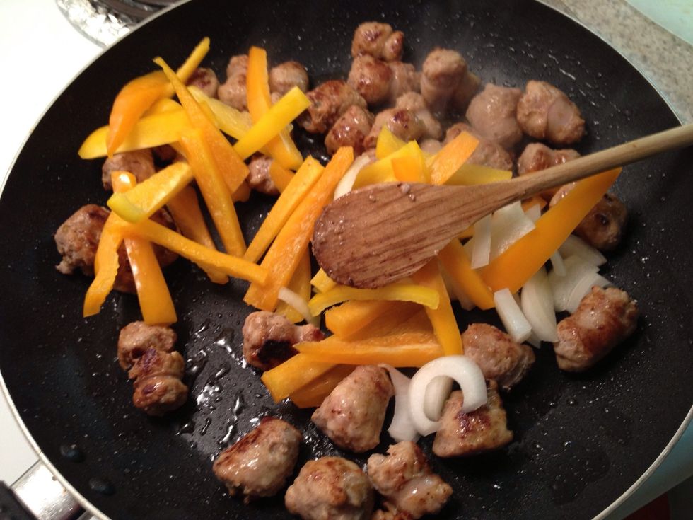 Once cooked add peppers and onions to the mix. Leave the juices this will caramelize the onions and peppers. Leave to simmer might want to turn down the heat. Stir often no burning.