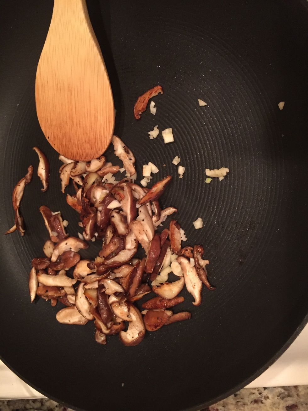 Once cooked, add the half the garlic. Cook for another minute or 2. Once cooked, take out and put the mushrooms and garlic into a bowl.