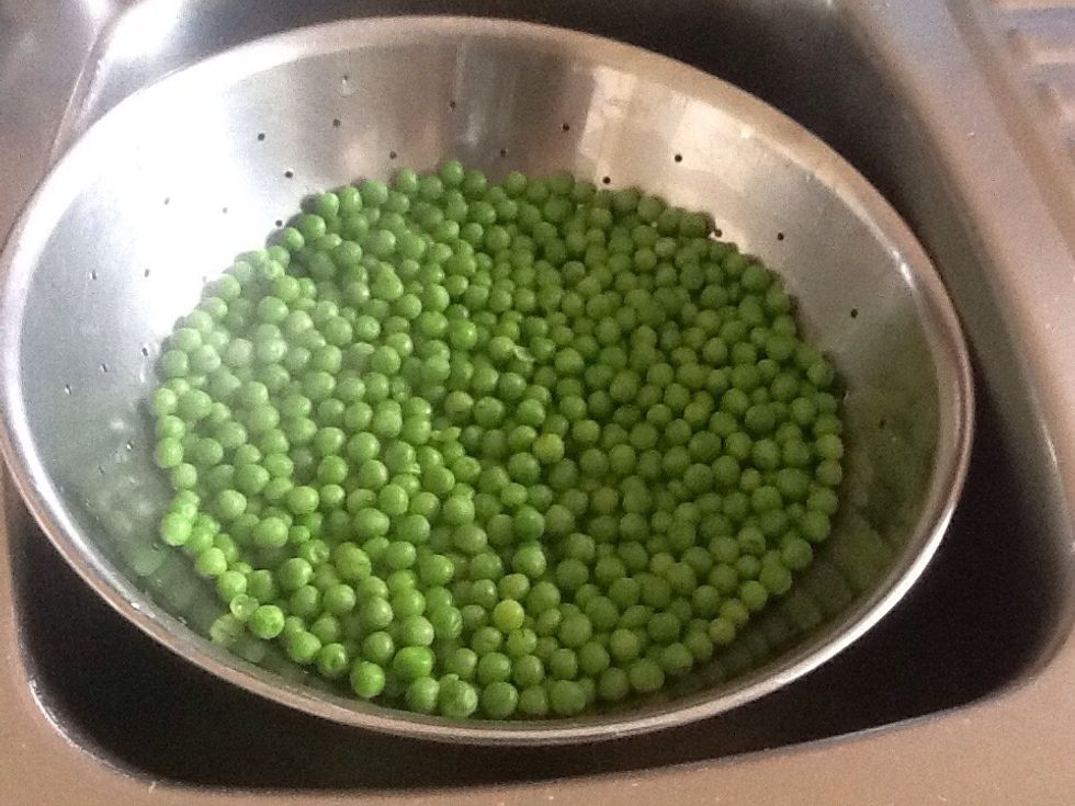 Once cooked place peas in drainer over the sink