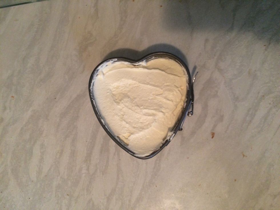 Once cool, dollop the topping mixture and smoothen in top making sure it doesn't overflow. You can also pipe the mixture using a star nozzle to make it outstanding!