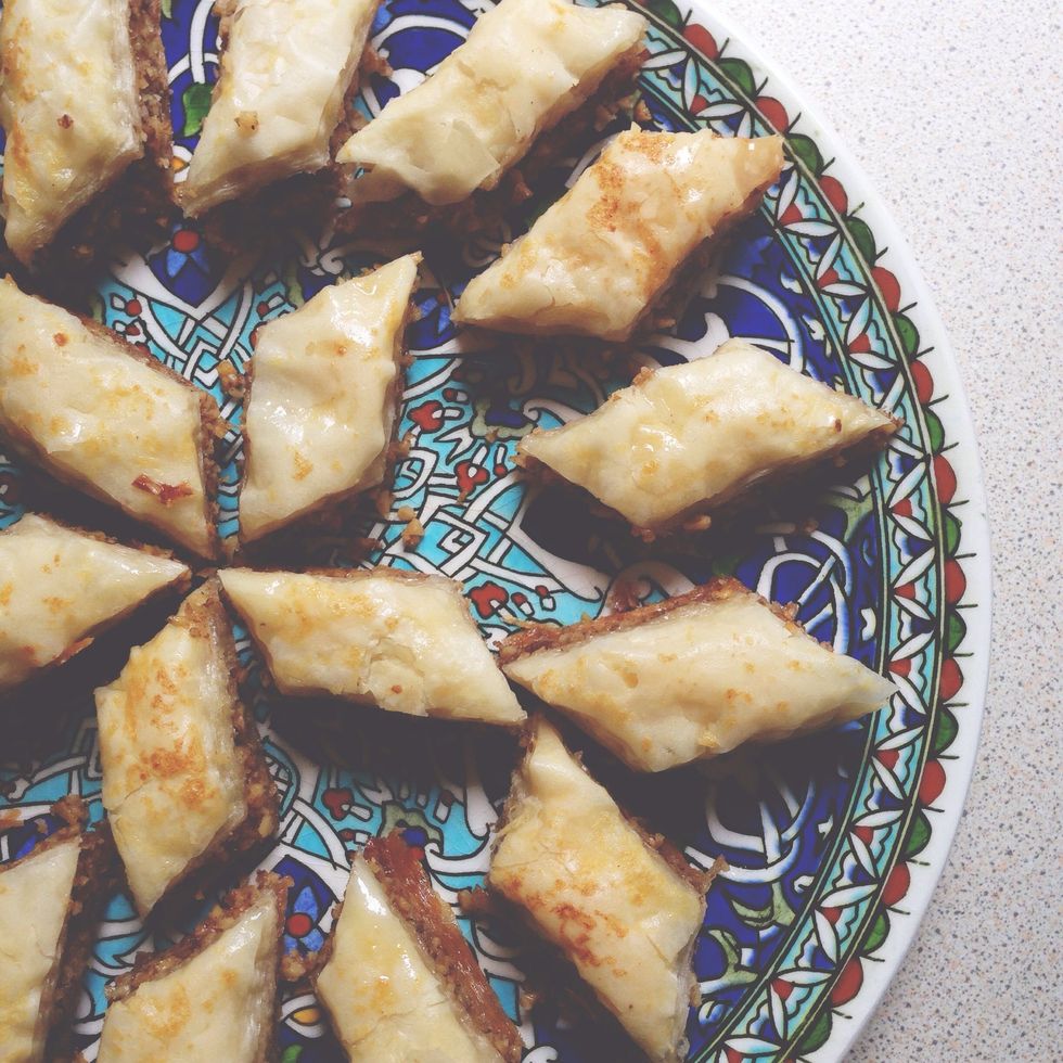 Once cool, remove baklava from tray. Garnish baklava with crushed pistachios if you like and enjoy - sahtein! (aka bon appetit!)