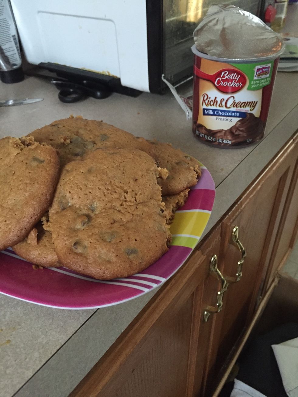 once cooled place cookies on a plate, and add frosting to cookies