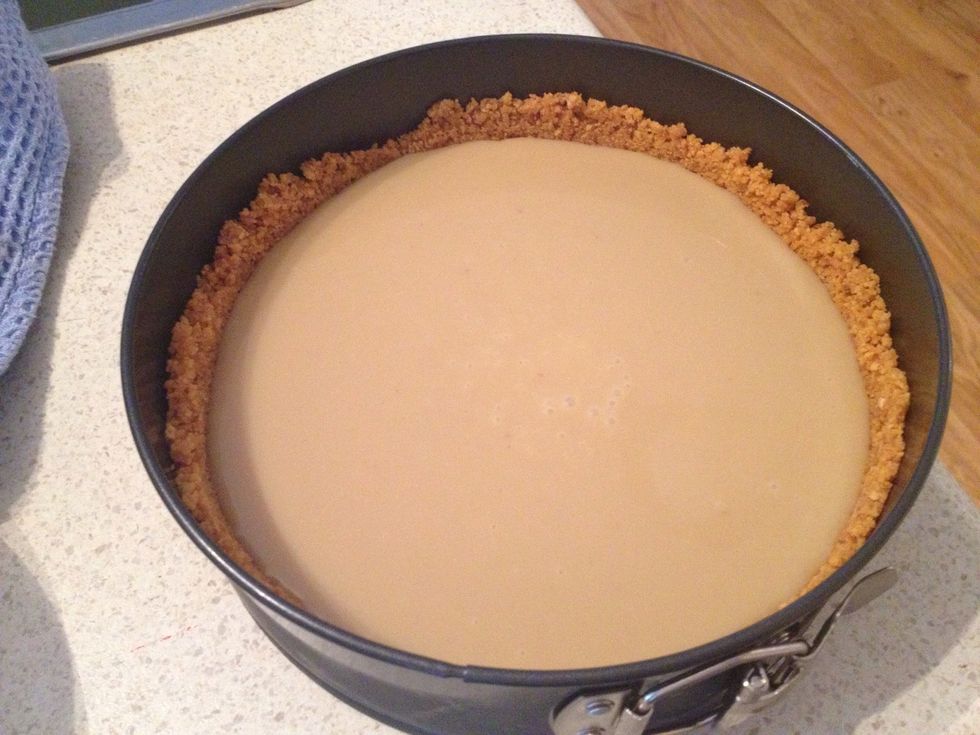 Once cooled, pour evenly into the previously prepared base and place back in the fridge until it sets (about an hour).