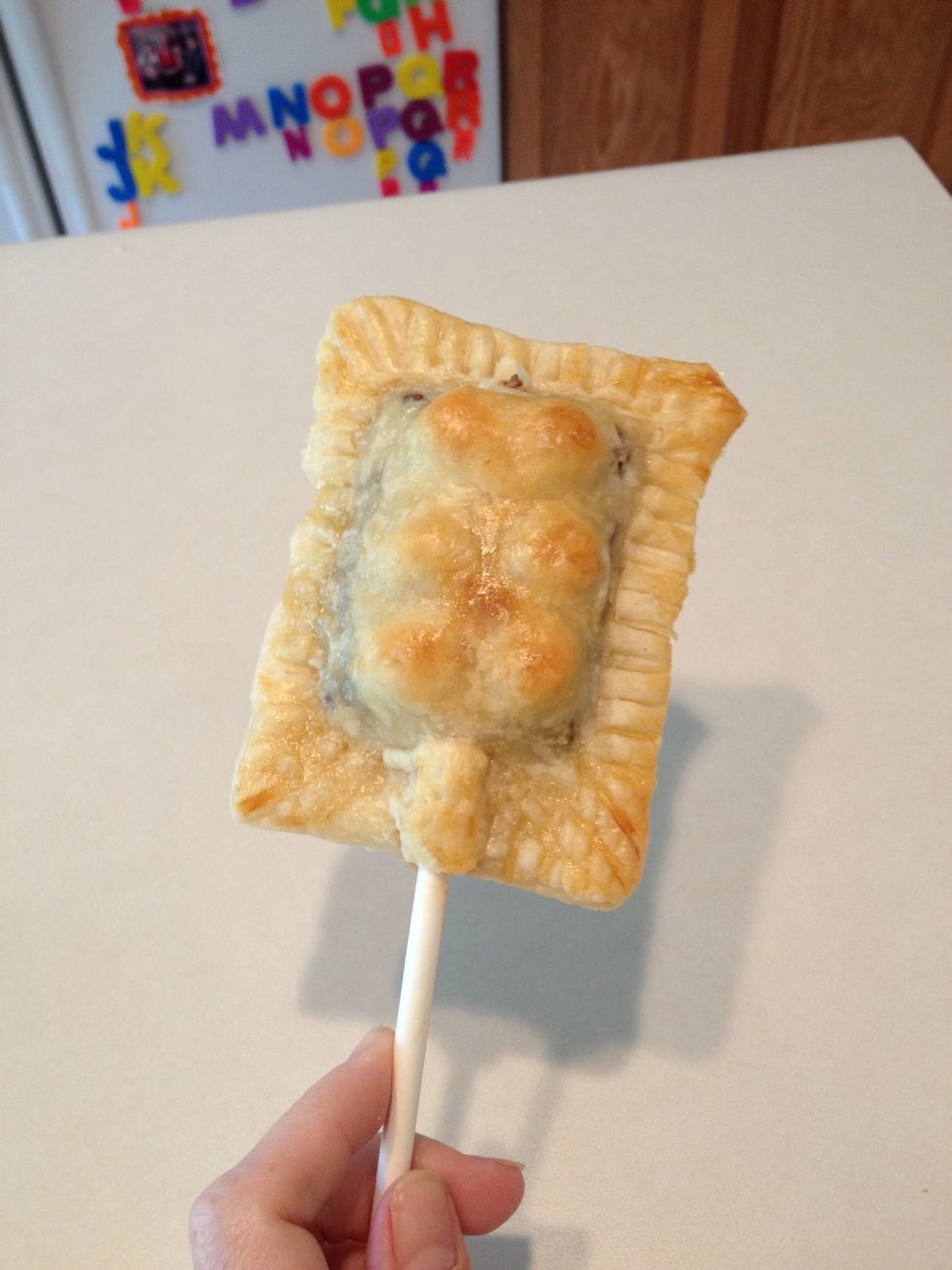 Once cooled you can eat your s'mores pie pop!  (Although I would recommend using a spatula to remove it from the baking pan.)